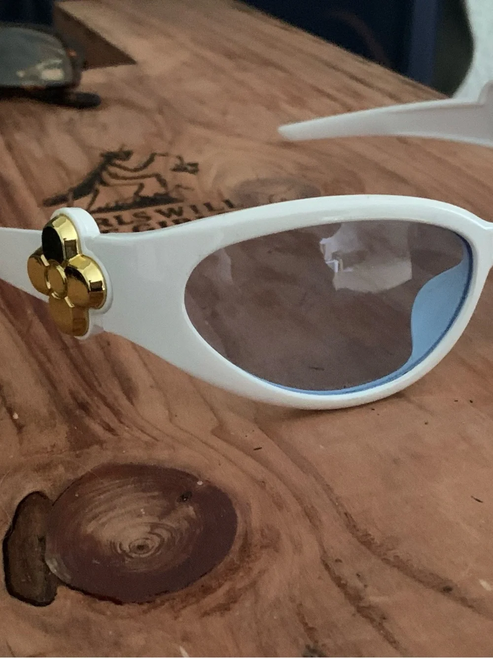 White Oval Sunglasses with Light Blue Lenses